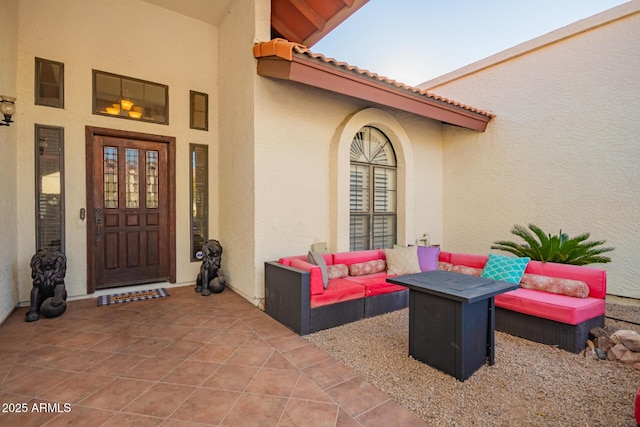 doorway to property featuring an outdoor hangout area and a patio area