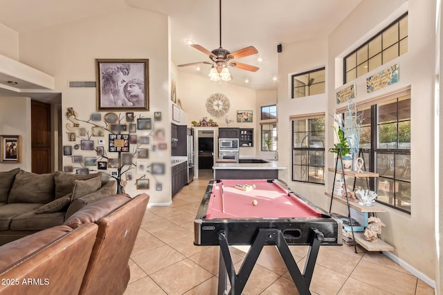 game room with ceiling fan, billiards, light tile patterned flooring, and high vaulted ceiling