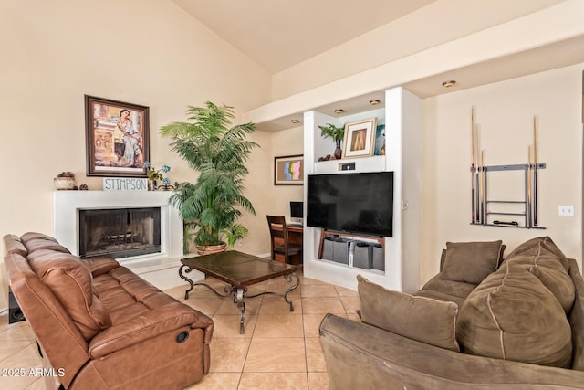 living room with high vaulted ceiling and light tile patterned flooring