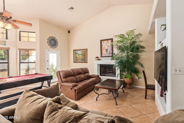 tiled living room featuring vaulted ceiling, ceiling fan, and pool table