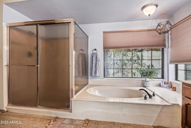 bathroom featuring vanity and plus walk in shower