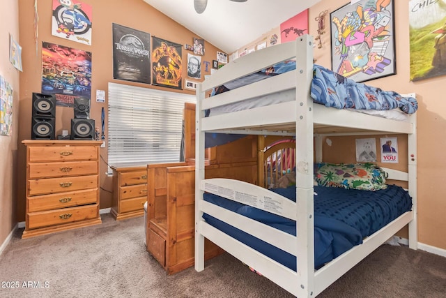 bedroom with vaulted ceiling and carpet flooring