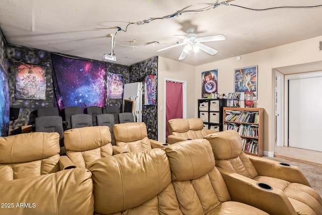 tiled home theater room with ceiling fan