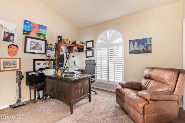 office featuring vaulted ceiling and light carpet