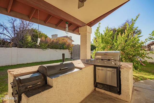 view of patio / terrace with an outdoor kitchen and a grill