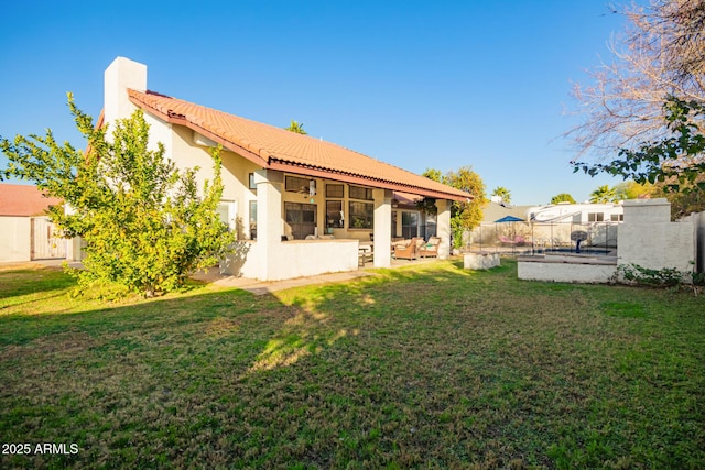 back of property with a patio area, outdoor lounge area, and a yard