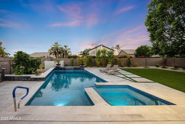 6435 E Monte Cristo Ave, Scottsdale, AZ 85254 - pool at dusk featuring an in-ground hot tub, a patio area, and a fenced backyard