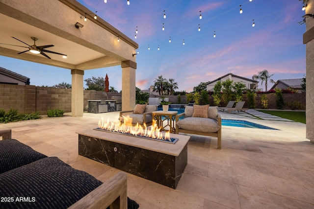 6435 E Monte Cristo Ave, Scottsdale, AZ 85254 - fenced backyard with a fire pit, ceiling fan, and a patio area