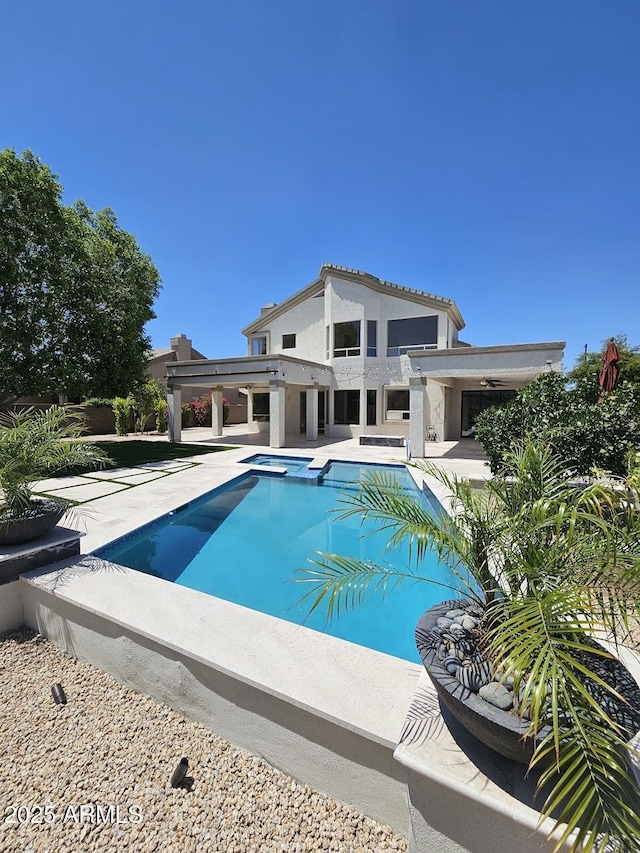 6435 E Monte Cristo Ave, Scottsdale, AZ 85254 - outdoor pool with a jacuzzi and a patio