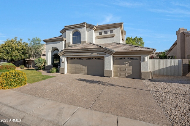 6435 E Monte Cristo Ave, Scottsdale, AZ 85254 - view of front facade with stucco siding, concrete driveway, a garage, and a tiled roof