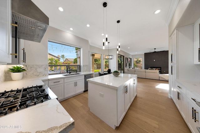 6435 E Monte Cristo Ave, Scottsdale, AZ 85254 - kitchen with dishwasher, a kitchen island, recessed lighting, light wood-type flooring, and open floor plan