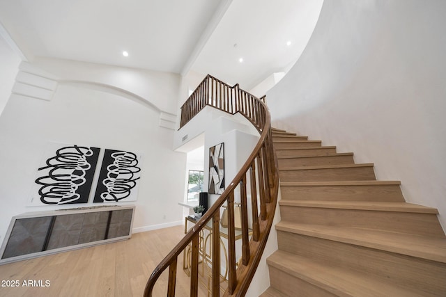6435 E Monte Cristo Ave, Scottsdale, AZ 85254 - stairs featuring wood finished floors, recessed lighting, and a high ceiling