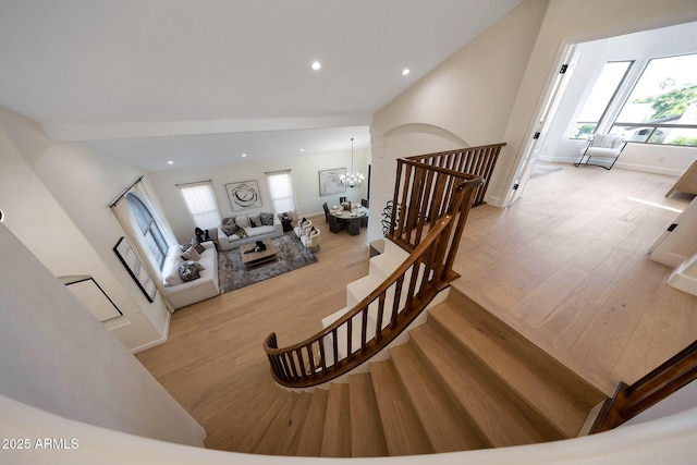 6435 E Monte Cristo Ave, Scottsdale, AZ 85254 - staircase with a chandelier, wood finished floors, and recessed lighting