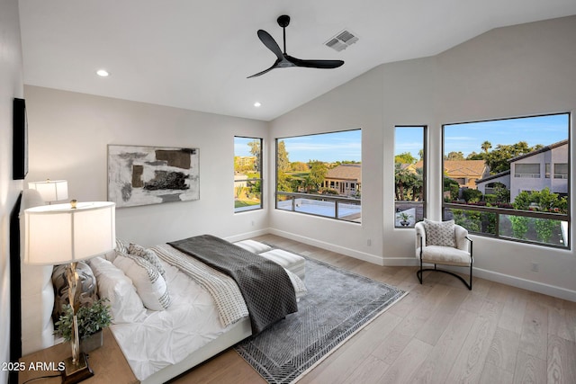 6435 E Monte Cristo Ave, Scottsdale, AZ 85254 - bedroom with multiple windows, vaulted ceiling, wood finished floors, recessed lighting, and a ceiling fan