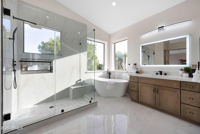 6435 E Monte Cristo Ave, Scottsdale, AZ 85254 - full bathroom featuring lofted ceiling, a marble finish shower, vanity, a freestanding tub, and marble finish flooring