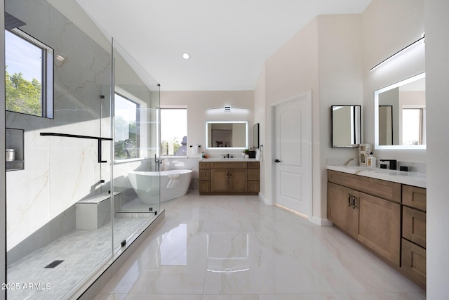 6435 E Monte Cristo Ave, Scottsdale, AZ 85254 - full bathroom featuring marble tiled flooring, a marble finish shower, two vanities, and a freestanding tub
