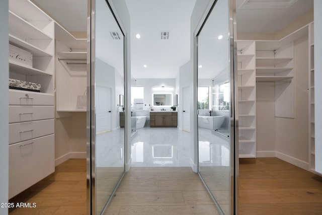 6435 E Monte Cristo Ave, Scottsdale, AZ 85254 - walk in closet featuring light wood-type flooring