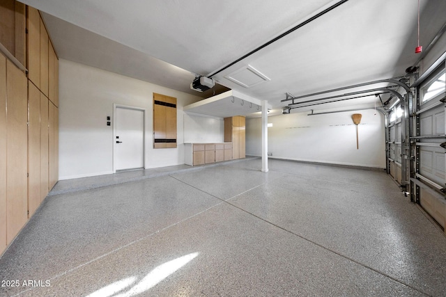 6435 E Monte Cristo Ave, Scottsdale, AZ 85254 - garage featuring a garage door opener and baseboards