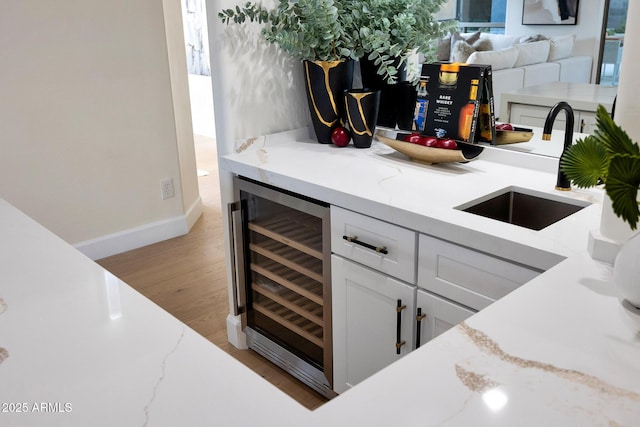 6435 E Monte Cristo Ave, Scottsdale, AZ 85254 - indoor dry bar with wine cooler and light wood finished floors