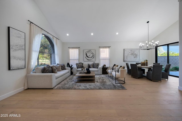 6435 E Monte Cristo Ave, Scottsdale, AZ 85254 - living area featuring high vaulted ceiling, a chandelier, plenty of natural light, light wood-type flooring, and recessed lighting