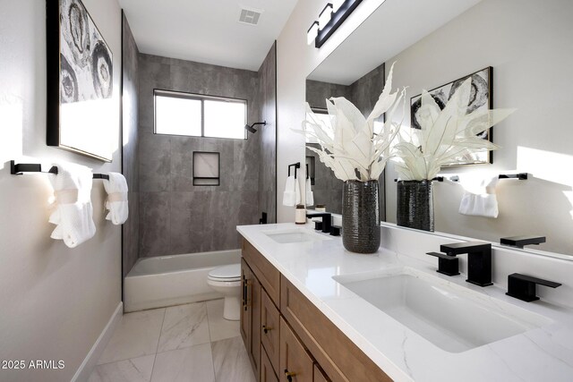 6435 E Monte Cristo Ave, Scottsdale, AZ 85254 - bathroom featuring double vanity, marble finish flooring, and washtub / shower combination