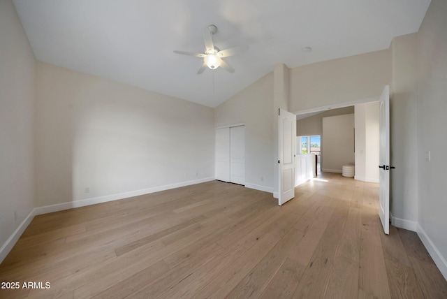 6435 E Monte Cristo Ave, Scottsdale, AZ 85254 - empty room with a ceiling fan, high vaulted ceiling, and light wood-style flooring