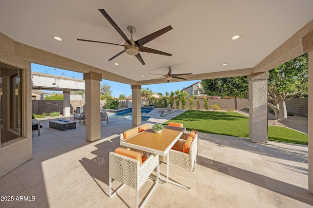 6435 E Monte Cristo Ave, Scottsdale, AZ 85254 - fenced backyard with a patio area, ceiling fan, and outdoor dining space