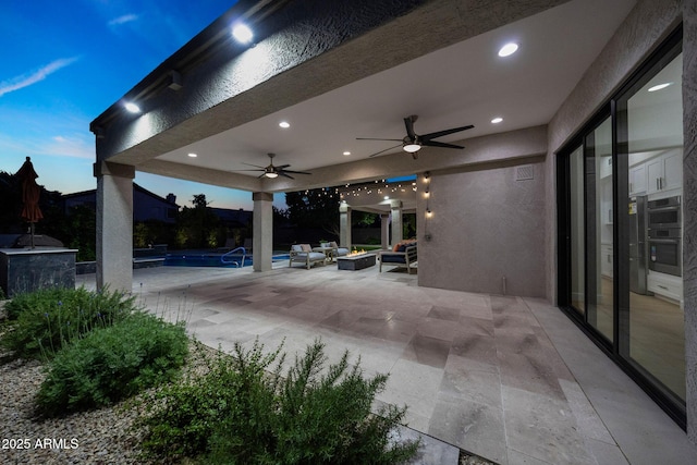 6435 E Monte Cristo Ave, Scottsdale, AZ 85254 - view of patio with ceiling fan and a fire pit