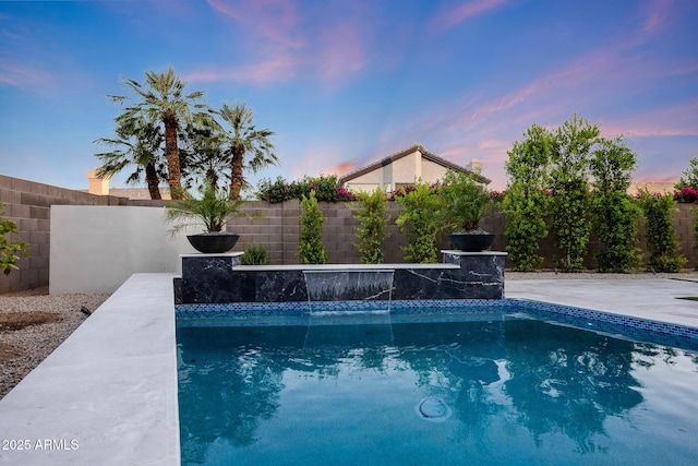 6435 E Monte Cristo Ave, Scottsdale, AZ 85254 - pool at dusk with a fenced backyard
