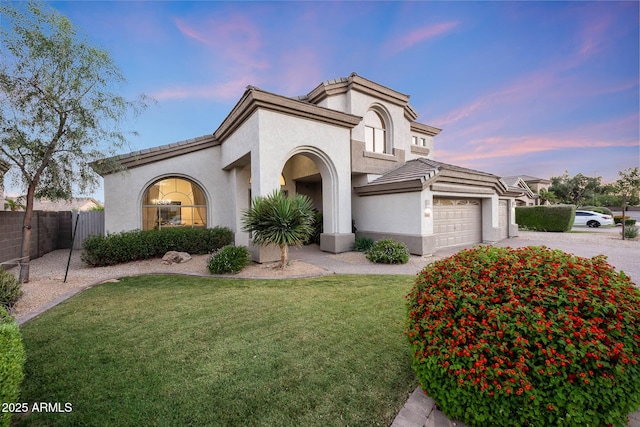 6435 E Monte Cristo Ave, Scottsdale, AZ 85254 - mediterranean / spanish home with stucco siding, an attached garage, driveway, and a tiled roof