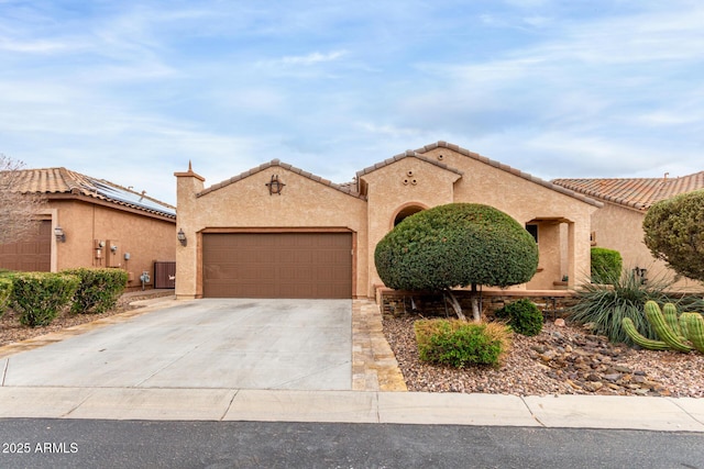 3937 N Smithsonian Dr, Florence, AZ 85132 - mediterranean / spanish-style house with a garage, stucco siding, a tile roof, and concrete driveway