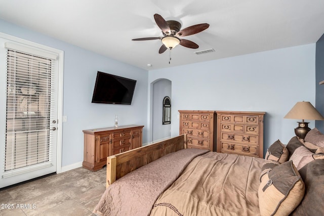 3937 N Smithsonian Dr, Florence, AZ 85132 - bedroom with arched walkways, baseboards, visible vents, and ceiling fan