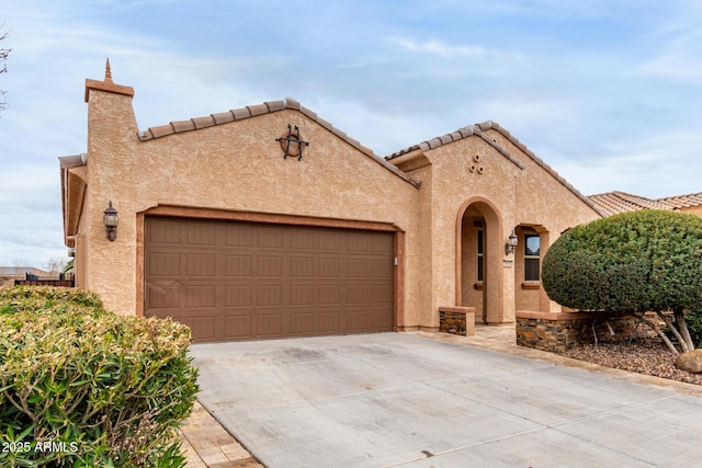 3937 N Smithsonian Dr, Florence, AZ 85132 - mediterranean / spanish-style house featuring an attached garage, stucco siding, driveway, and a tile roof