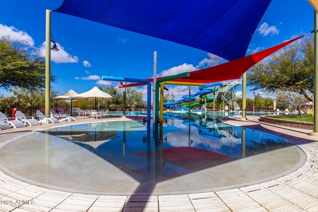 3937 N Smithsonian Dr, Florence, AZ 85132 - community pool with fence and a water slide