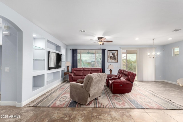 3937 N Smithsonian Dr, Florence, AZ 85132 - living area with baseboards, arched walkways, built in shelves, and visible vents
