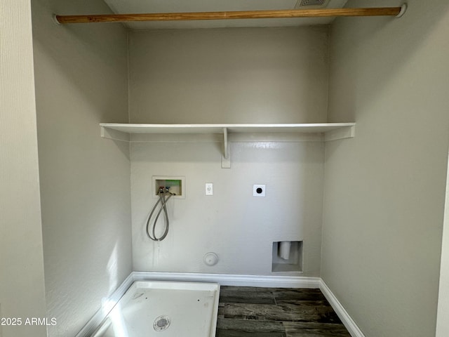 laundry room with laundry area, visible vents, wood finished floors, hookup for a washing machine, and electric dryer hookup