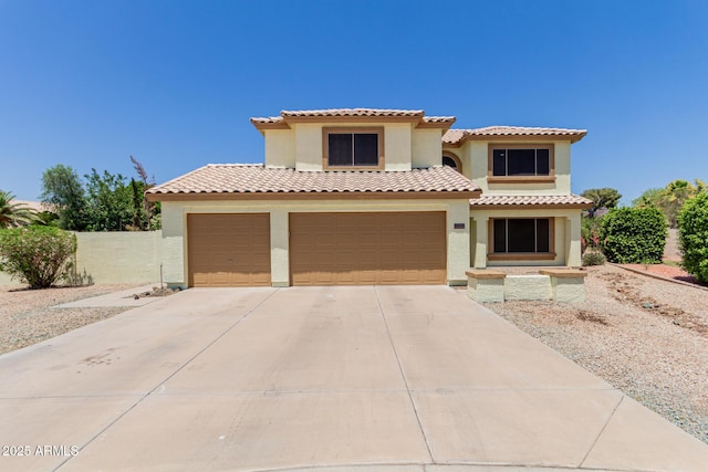6276 N 75th Ln, Glendale, AZ 85303 - mediterranean / spanish home with stucco siding, driveway, a garage, and a tile roof