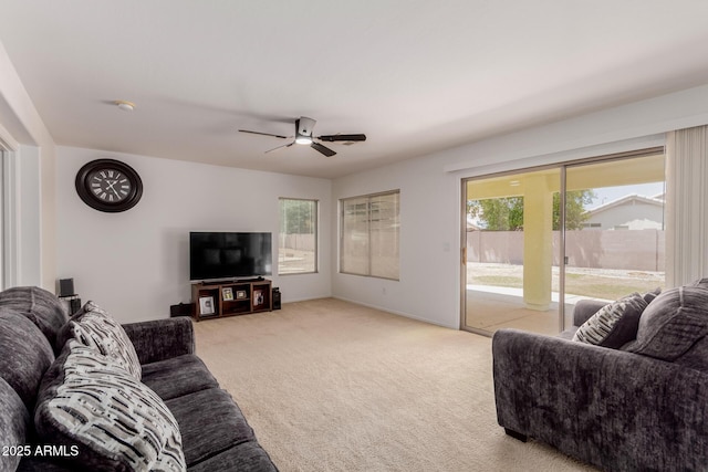 6276 N 75th Ln, Glendale, AZ 85303 - living area featuring light colored carpet, ceiling fan, and baseboards