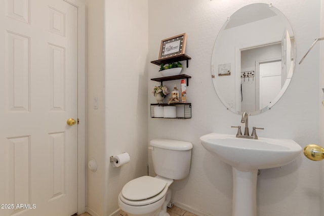6276 N 75th Ln, Glendale, AZ 85303 - half bathroom featuring baseboards, toilet, and tile patterned floors