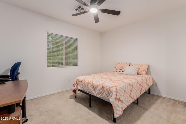 6276 N 75th Ln, Glendale, AZ 85303 - bedroom featuring carpet floors, a desk, a ceiling fan, and baseboards