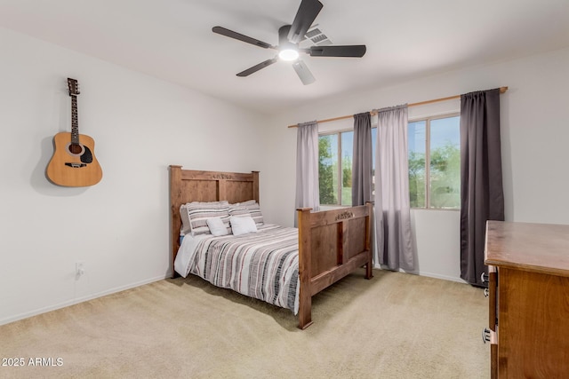 6276 N 75th Ln, Glendale, AZ 85303 - bedroom with light colored carpet, baseboards, and ceiling fan