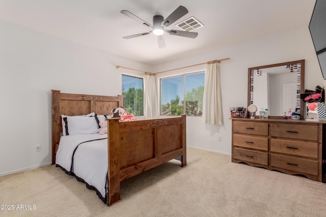 6276 N 75th Ln, Glendale, AZ 85303 - bedroom featuring light carpet, baseboards, and ceiling fan