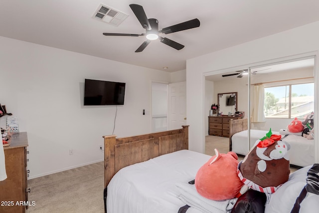 6276 N 75th Ln, Glendale, AZ 85303 - bedroom with light carpet, a ceiling fan, and baseboards