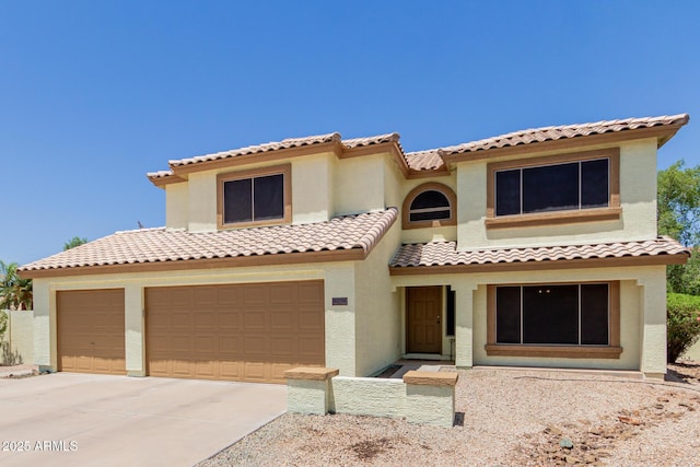 6276 N 75th Ln, Glendale, AZ 85303 - mediterranean / spanish home with driveway, stucco siding, a tile roof, and a garage