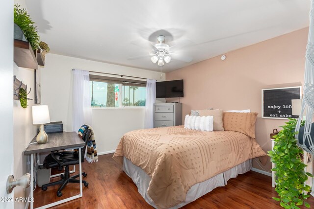 bedroom featuring ceiling fan and dark wood-type flooring