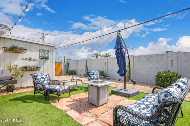 view of patio featuring an outdoor fire pit