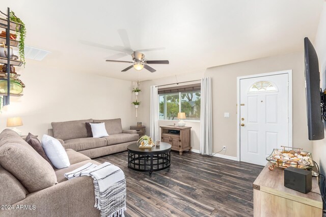 living room with dark hardwood / wood-style floors and ceiling fan