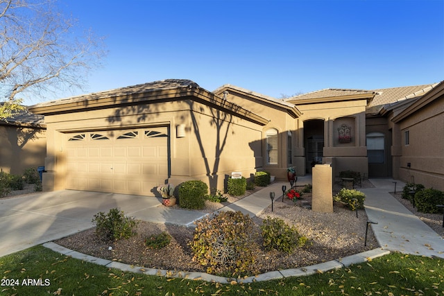 view of front of property with a garage