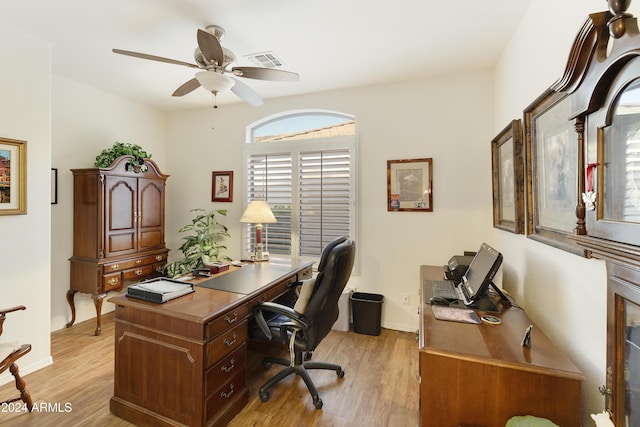 office space with ceiling fan and light hardwood / wood-style flooring