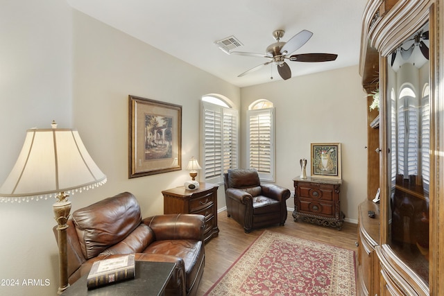 sitting room featuring ceiling fan and light hardwood / wood-style floors